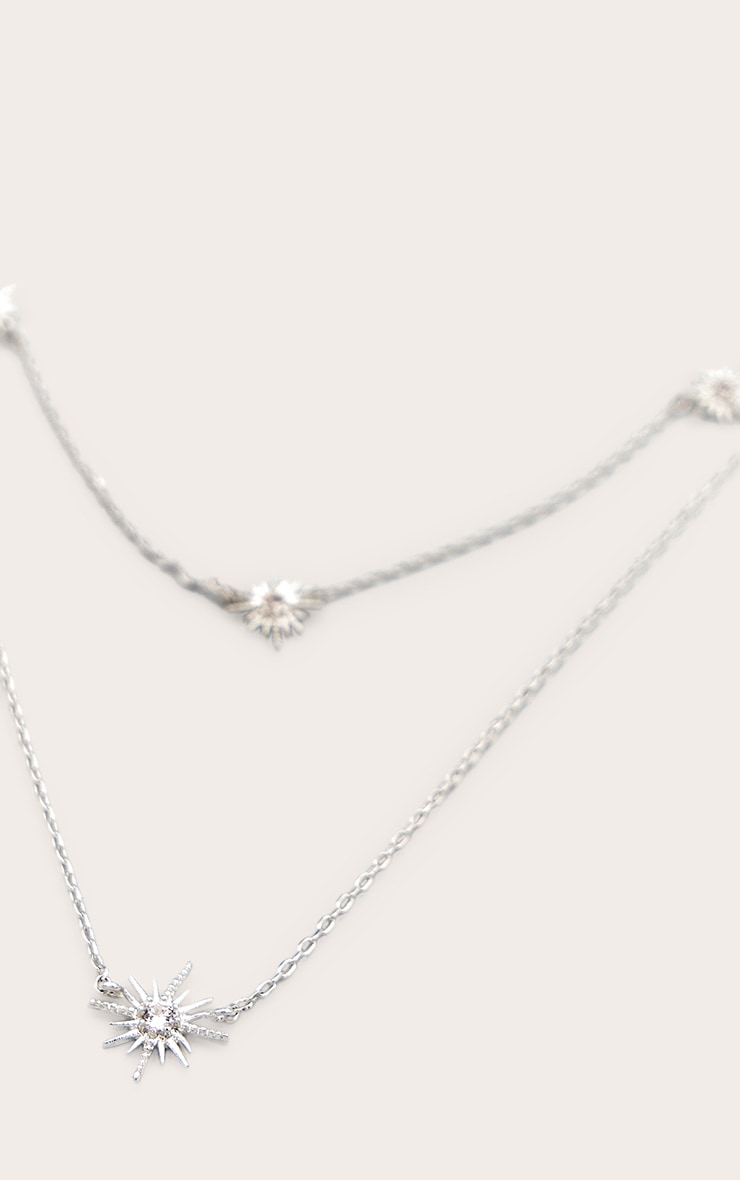 https://cdn-img.prettylittlething.com/1/6/a/0/16a0de32cc66b1889ad0b8ddbb3bc0e366379ae0_CMU9860_2_real_silver_plated_star_diamante_necklace.jpg