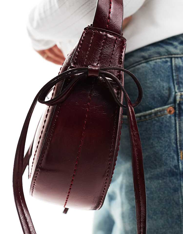 https://images.asos-media.com/products/asos-design-half-moon-shoulder-bag-with-side-bow-detail-in-burgundy/206697413-4?$n_750w$&wid=750&fit=constrain