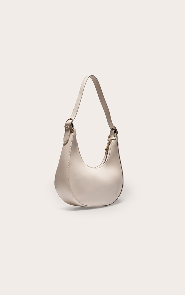 https://cdn-img.prettylittlething.com/3/0/d/1/30d1f140461c03051547b1ee50c772f4de2c7186_CMS9383_2_cream_curved_pu_shoulder_bag.jpg
