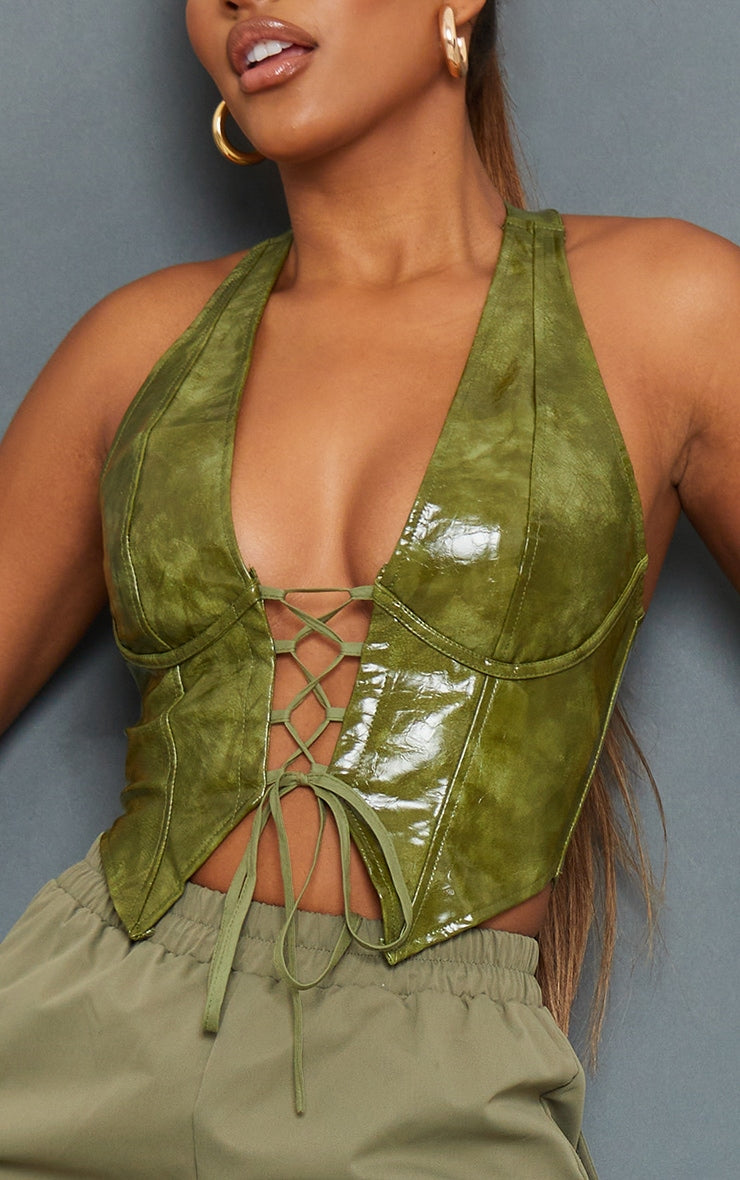 https://cdn-img.prettylittlething.com/1/b/1/a/1b1af47c34dfcfa2d81a069edf65886dc0480774_CMT6698_4_olive_washed_faux_leather_lace_up_plunge_halterneck_top.jpg