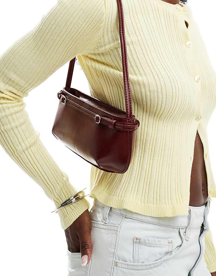 https://images.asos-media.com/products/asos-design-shoulder-bag-with-buckle-detail-in-burgundy/206956978-4?$n_750w$&wid=750&fit=constrain