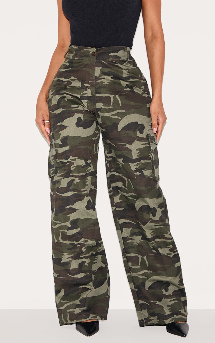 https://cdn-img.prettylittlething.com/4/b/f/7/4bf70000b8f7e9c1cd48d18bd69f3ee5a42b6ab6_CMY8015_2_shape_khaki_camo_print_pocket_detail_wide_leg_cargo_trousers.jpg