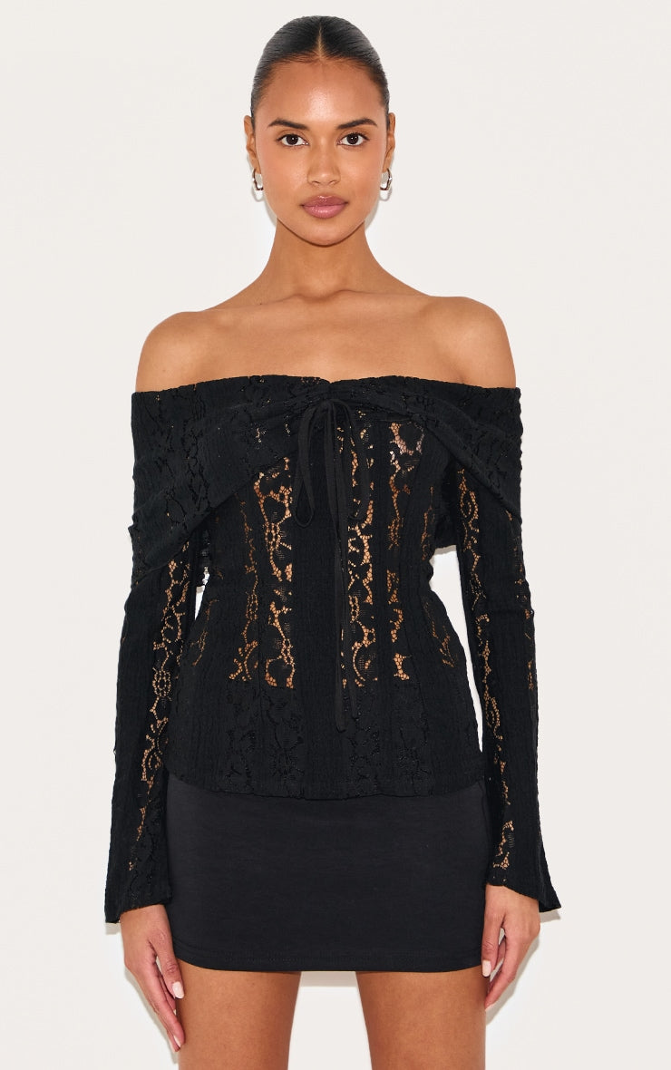 https://cdn-img.prettylittlething.com/6/2/1/a/621a267fc8d8dbdd214e39ebfe124940e61c89be_CNL7495_1_black_fitted_lace_flared_sleeve_bardot_top.jpg