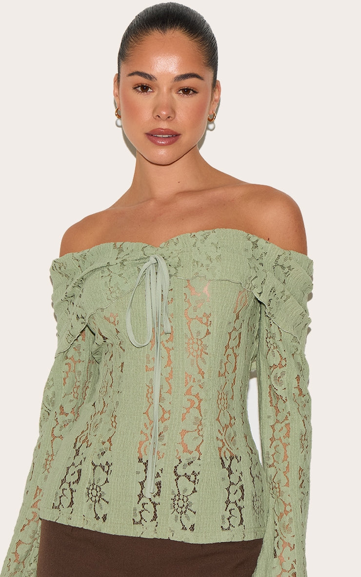 https://cdn-img.prettylittlething.com/7/2/7/0/727012022f4167ac61d7fb013ab266b7075afa9a_CNL9805_4_sage_fitted_lace_flared_sleeve_bardot_top.jpg