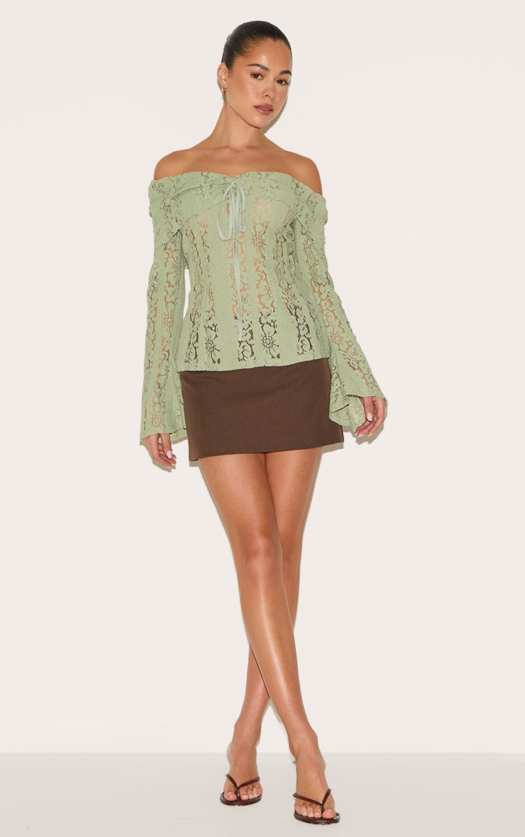 https://cdn-img.prettylittlething.com/8/8/a/a/88aaff23089fddec19ba95652e66a076dcc76bee_CNL9805_3_sage_fitted_lace_flared_sleeve_bardot_top.jpg