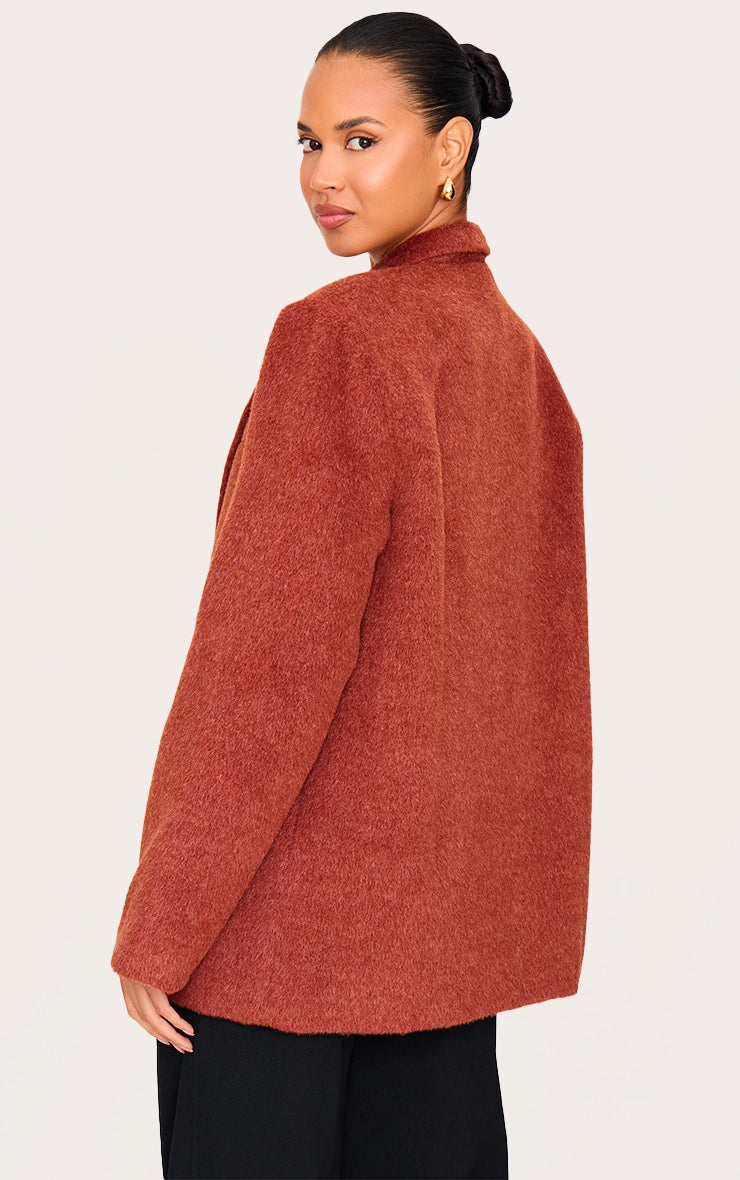 https://cdn-img.prettylittlething.com/8/f/e/8/8fe8fe0cd97a7caf4f6cdcbb134df63ad73cb346_CNL6376_2_burnt_orange_oversized_textured_wool_look_blazer.jpg