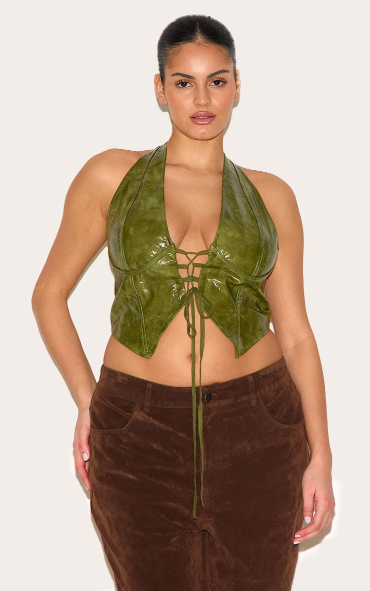 https://cdn-img.prettylittlething.com/a/f/9/8/af98e022fbef28d3d6568a554e0d245c6660d84f_CNE0792_1_plus_olive_washed_faux_leather_lace_up_plunge_halterneck_top.jpg