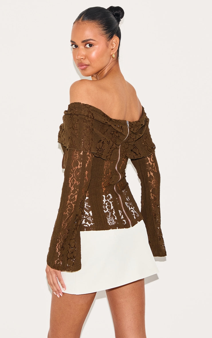 https://cdn-img.prettylittlething.com/b/0/7/5/b07513a5f7b274c22084b1d5f67e64adf7dbfd09_CNL7494_2_chocolate_fitted_lace_flared_sleeve_bardot_top.jpg