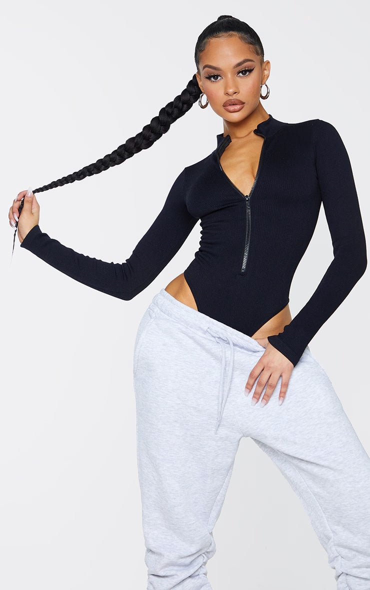 https://cdn-img.prettylittlething.com/c/7/d/a/c7da19f39ac74f344c2ca1a2d55aec1207df8794_CMT6658_1_black_contour_rib_zip_up_long_sleeve_bodysuit.jpg