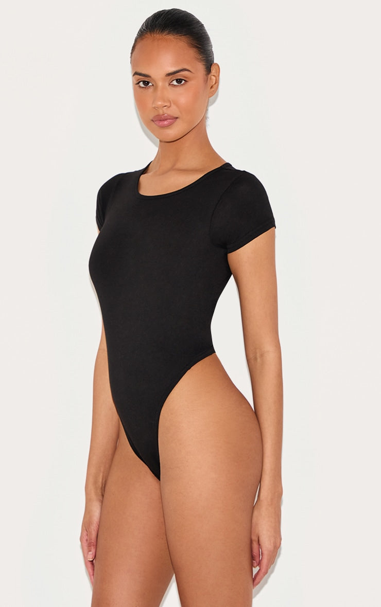 https://cdn-img.prettylittlething.com/d/c/e/e/dcee9612784b7b79aaf2dc05391210ca4a1155ec_CMP1948_2_basic_black_cotton_blend_fitted_short_sleeve_bodysuit.jpg