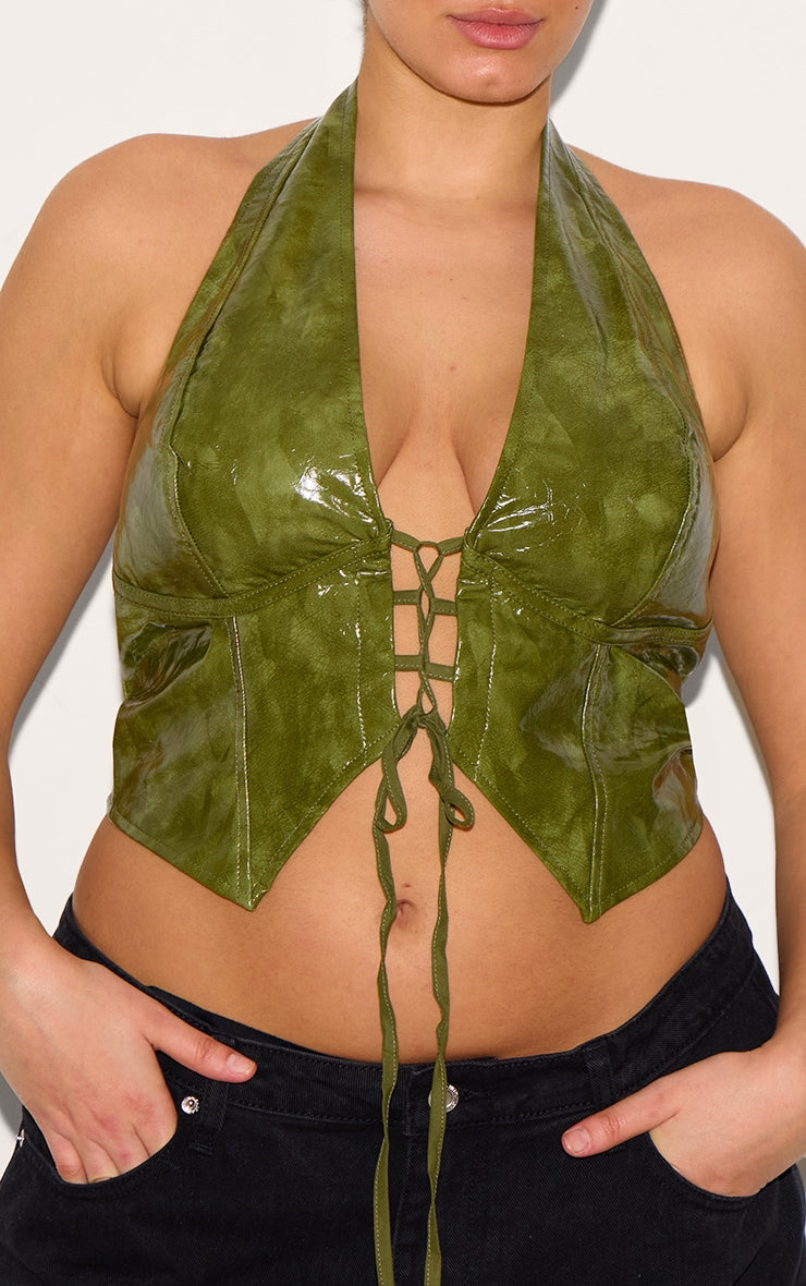https://cdn-img.prettylittlething.com/f/3/c/3/f3c35853479a631fadef8ee1a0b8798e2001e85c_CNL8702_4_plus_washed_olive_faux_leather_lace_up_plunge_halterneck_top.jpg