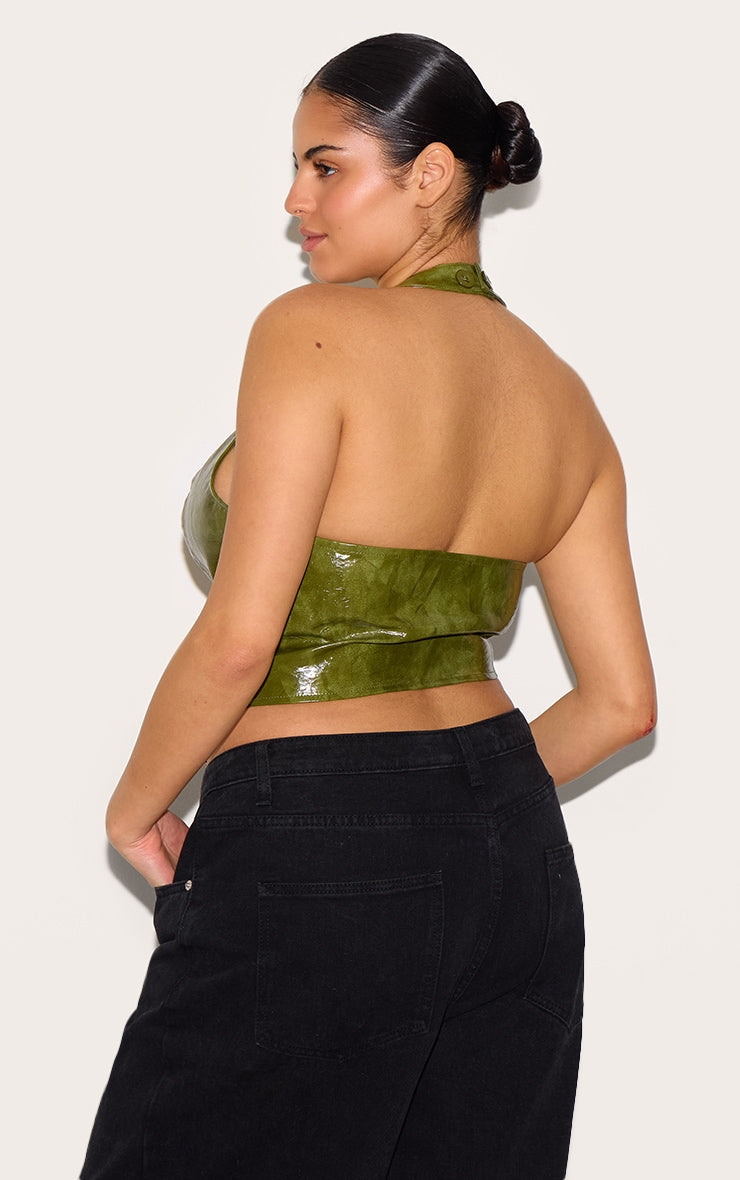 https://cdn-img.prettylittlething.com/f/b/8/6/fb862396e6df50553b286bcd150e031bb60eaceb_CNL8702_2_plus_washed_olive_faux_leather_lace_up_plunge_halterneck_top.jpg